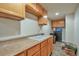 Basement laundry area with cabinets and ample counter space for convenience at 479 W Jamison Cir, Littleton, CO 80120