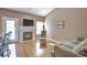 Living Room features a gas fireplace, and gleaming wood floors at 479 W Jamison Cir, Littleton, CO 80120