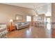 Open concept living room and dining area with gleaming wood floors at 479 W Jamison Cir, Littleton, CO 80120