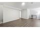 Open basement with laminate floors and a small table at 9044 E Nassau Ave, Denver, CO 80237