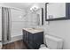 This bathroom has a shower and tub combo, and vanity at 9044 E Nassau Ave, Denver, CO 80237