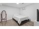 Bedroom featuring laminate floors, a bed and a mirror at 9044 E Nassau Ave, Denver, CO 80237