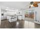 Spacious kitchen with white cabinets, stainless steel appliances, and a sliding door to the outdoor patio at 9044 E Nassau Ave, Denver, CO 80237