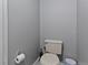 This powder room has a toilet and a paper towel holder at 9044 E Nassau Ave, Denver, CO 80237