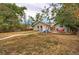 Charming home featuring a spacious backyard with a stone walkway, and an inviting seating area at 3074 S Elati St, Englewood, CO 80110