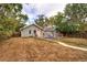 Charming home featuring a spacious backyard with a stone walkway, and an inviting seating area at 3074 S Elati St, Englewood, CO 80110