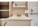 Bathroom with a white sink and vintage-style faucet, plus a large mirror at 3074 S Elati St, Englewood, CO 80110