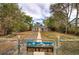 Charming single-Gathering home featuring mature trees and a well-manicured front yard at 3074 S Elati St, Englewood, CO 80110