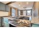 Modern kitchen with granite countertops, stainless steel oven, and updated cabinetry at 3074 S Elati St, Englewood, CO 80110