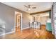 Open living space with hardwood floors connecting to a kitchen island at 3074 S Elati St, Englewood, CO 80110