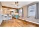 Open living area with hardwood floors, and seamless flow to the kitchen at 3074 S Elati St, Englewood, CO 80110