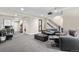 Finished basement featuring a spacious entertainment area and stairs to the upper level at 9154 E 37Th Ave, Denver, CO 80238