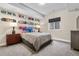 Cozy bedroom featuring decorative skateboards, a neutral color scheme, and ambient lighting at 9154 E 37Th Ave, Denver, CO 80238