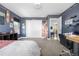 Cozy bedroom with skateboard decor, neutral carpet, and a glimpse of an open doorway at 9154 E 37Th Ave, Denver, CO 80238