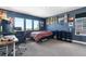 Teen bedroom with large windows, skateboard decor, and a comfortable workspace at 9154 E 37Th Ave, Denver, CO 80238