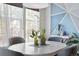 Stylish dining area features a round table, comfortable chairs, and modern accents at 9154 E 37Th Ave, Denver, CO 80238
