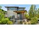 Contemporary home with a covered entryway, well-maintained landscaping, and great curb appeal at 9154 E 37Th Ave, Denver, CO 80238