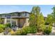 Eye-catching modern home with natural stone accents, professional landscaping, and a welcoming entrance at 9154 E 37Th Ave, Denver, CO 80238