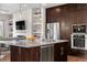 Modern kitchen with stainless steel appliances, granite countertops, and center island at 9154 E 37Th Ave, Denver, CO 80238