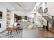Open-concept living room featuring a staircase with hardwood floors and a comfortable sectional sofa at 9154 E 37Th Ave, Denver, CO 80238