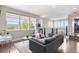 Bright living room with a comfortable gray sofa, and modern decor at 9154 E 37Th Ave, Denver, CO 80238