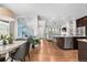 Open-concept living space featuring modern decor, hardwood floors, and abundant natural light at 9154 E 37Th Ave, Denver, CO 80238