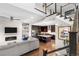 Open-concept living space with view of kitchen, fireplace, stairs and decor accents at 9154 E 37Th Ave, Denver, CO 80238