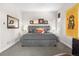 Stylish main bedroom with tufted headboard, decorative pillows, art, and ambient lighting at 9154 E 37Th Ave, Denver, CO 80238