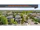 Street view of modern homes in a well maintained community neighborhood with mature trees at 9154 E 37Th Ave, Denver, CO 80238