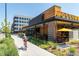 Attractive street scene featuring a restaurant with outdoor seating, inviting landscaping, and pedestrian-friendly sidewalks at 838 N Cherry St # 1, Denver, CO 80220