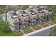 Overhead view of modern townhomes showcasing rooftop patios, balconies, brick and siding exteriors, and fenced yards at 838 N Cherry St # 1, Denver, CO 80220