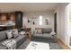 Open-concept living room with modern sofas, decor, adjacent to the kitchen create an inviting living space at 838 N Cherry St # 1, Denver, CO 80220