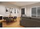 Bright living room with modern furniture, dining table, large window, and stylish decor create a cozy ambiance at 838 N Cherry St # 1, Denver, CO 80220