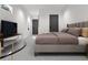 Serene main bedroom featuring a comfortable bed, soft lighting, and ample space for relaxation and rest at 838 N Cherry St # 1, Denver, CO 80220