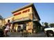 Trader Joe's entrance; features a warm-toned exterior with stone accents and lush flower displays at 838 N Cherry St # 1, Denver, CO 80220