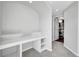 Finished basement includes built-in desk area and leads to a bathroom area at 7511 S Sicily Way, Aurora, CO 80016