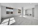 Finished basement area features bright light and neutral paint and carpet colors at 7511 S Sicily Way, Aurora, CO 80016
