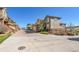 Charming townhome exterior with a two car garage and well-maintained landscaping at 7511 S Sicily Way, Aurora, CO 80016