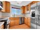 Kitchen with stainless steel appliances and hardwood flooring at 7511 S Sicily Way, Aurora, CO 80016