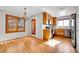 Kitchen featuring stainless steel appliances, natural lighting, and hardwood flooring at 7511 S Sicily Way, Aurora, CO 80016