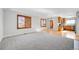 Bright open concept living space with hardwood flooring and natural lighting at 7511 S Sicily Way, Aurora, CO 80016