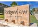 Community sign 'Ridgeview Eagle Bend' with stone base and manicured landscaping at 7511 S Sicily Way, Aurora, CO 80016