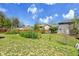 The expansive backyard is perfect for outdoor living with its green lawn, surrounding fences, and lush greenery at 807 Mobile St, Aurora, CO 80011