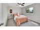 Cozy bedroom with a patterned bed, bright natural light, and a calm atmosphere for restful nights at 807 Mobile St, Aurora, CO 80011