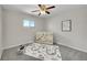 Charming Bedroom with a neutral color scheme, featuring a baby bed, a playful rug, and plenty of natural light at 807 Mobile St, Aurora, CO 80011