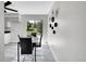 Cozy dining area with a modern table set, a view of the outdoors and trendy wall decor at 807 Mobile St, Aurora, CO 80011