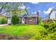 Charming home with a well-manicured lawn and mature trees, creating great curb appeal at 807 Mobile St, Aurora, CO 80011