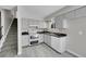 Functional kitchen with gray cabinets, dual oven and plenty of counter space at 807 Mobile St, Aurora, CO 80011