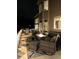 Exterior deck with a wicker patio seating area, built in grill, and lighting at 4142 S Deframe Ct, Morrison, CO 80465