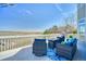 Outdoor deck featuring wicker patio furniture set with scenic views and steel grill at 4142 S Deframe Ct, Morrison, CO 80465
